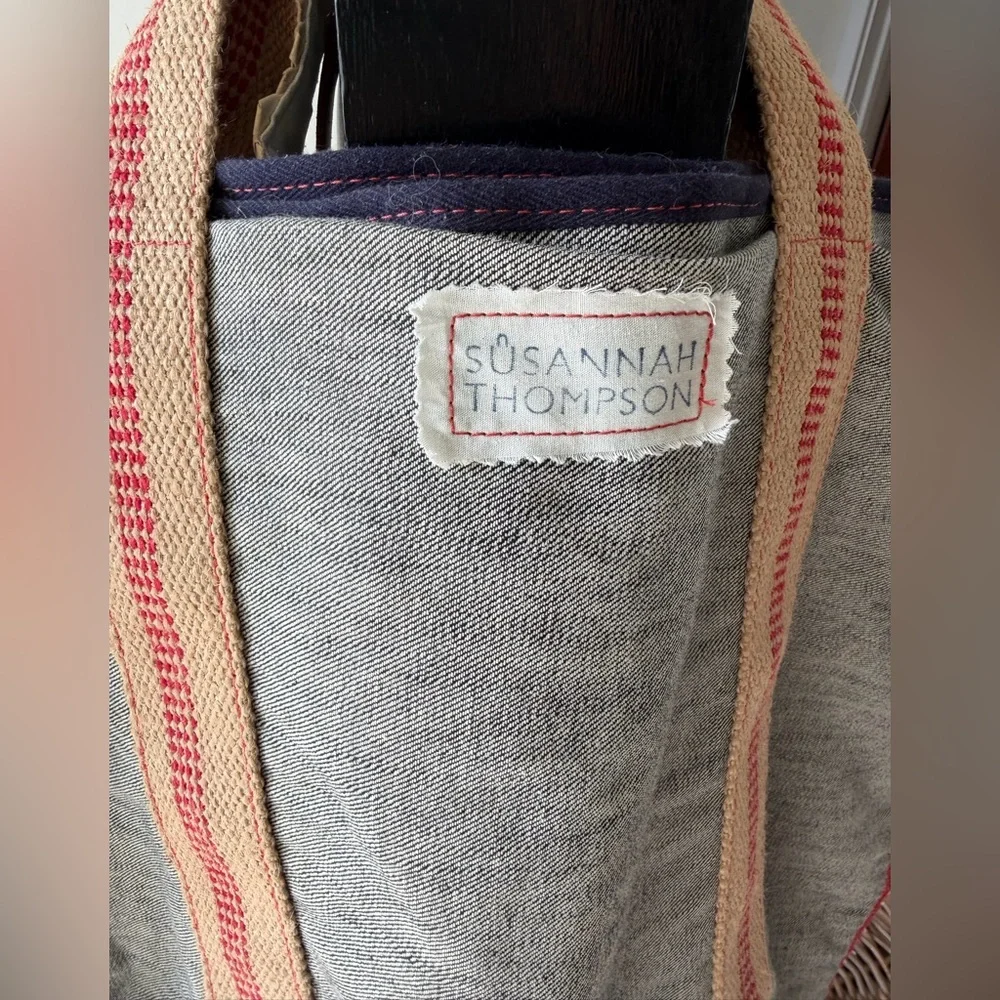 Susannah Thompson Laundry Tote. Gray, tan natural fiber, red-trim handles.